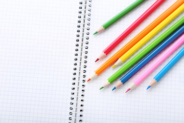 Drawing colourful pencils with blank notebook