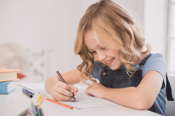 Little kid girl drawing at home creativity development