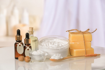 Composition of Shea butter with cosmetic products on table