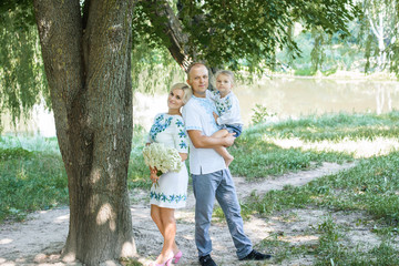 Fototapeta premium Portrait Of Happy Family In Garden At Home