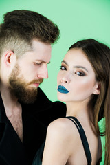 couple of bearded man, woman in black with fashionable makeup