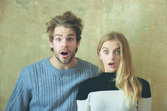 Wow! Surprised man and woman with open mouth, young couple