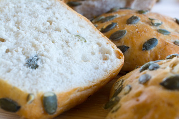 Buns with pumpkin seeds closeup.