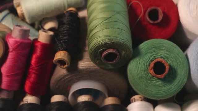 different sizes coil of thread bobbin reel and spool camera motion macro shot
