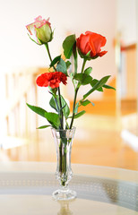 White rose, red rose and a red carnation