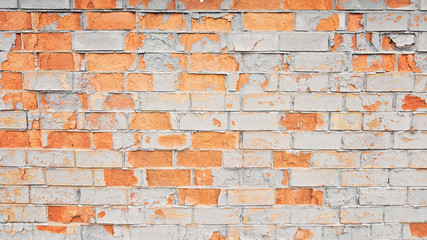 Vintage old painted distressed grungy brick wall surface.