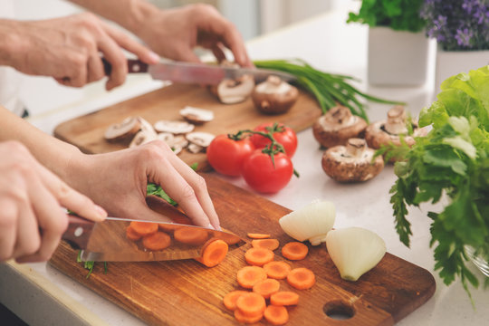 Family Cooking Meal Preparation Together Cutting Ingredients 