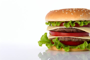 Hamburger with meat, cheese and fresh vegetables.