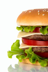 Hamburger with meat, cheese and fresh vegetables.