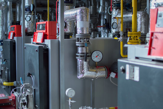 Modern high power industrial gas boilers with natural gas burners in the gas boiler plant