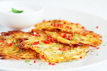 rosti with sour cream, parsley, and chili papper