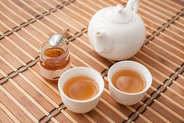 Cup of tea with teapot