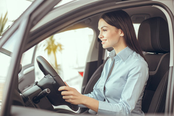 Young Woman in a Car Rental Service Test Drive Concept