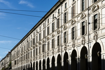 Fototapeta premium Colonnade and antique palaces of via Po, one of the main baroque streets of the center of Turin (Piedmont, Italy)