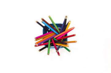 Color pencils in pencil holder isolated on white background, top view.