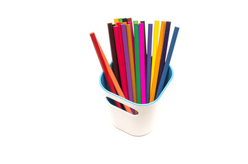 Color pencils in pencil holder isolated on white background.