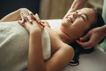 doctor massaging or doing gymnastics baby girl