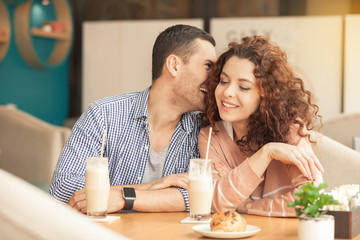 Fototapeta premium Nice looking couple in cafe