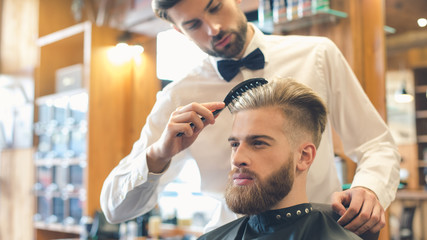Young Man in Barbershop Hair Care Service Concept