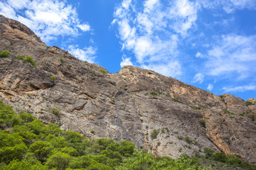 Fototapeta na wymiar rocks is situated against blue sky background.