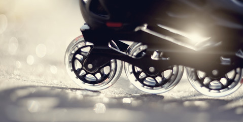 Naklejka na ściany i meble Road and wheels of roller skates closeup