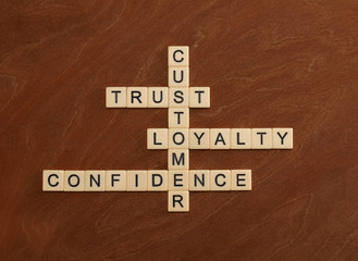 Crossword puzzle with words Trust, Loyalty, Confidence. Customer loyalty concept.