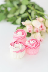 Fototapeta na wymiar Baby shower cupcakes and roses