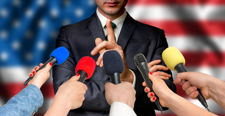 American candidate speaks to reporters - journalism concept