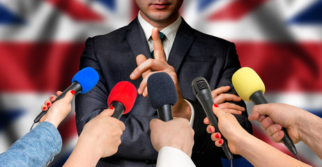 British candidate speaks to reporters - journalism concept
