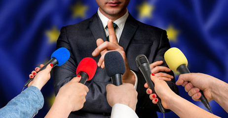 European candidate speaks to reporters - journalism concept