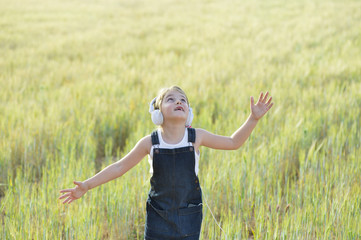 Happy girl dancing while listening to music
