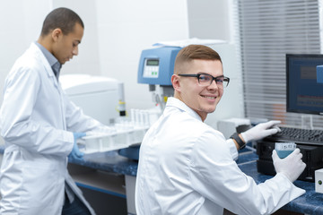 Young male scientist working at the laboratory