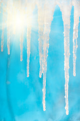 Frozen icicles in clear sunny against the blue sky