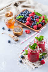 Healthy mixed smoothie for breakfast with berries, blueberry, raspberry