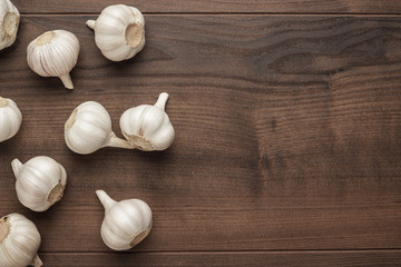 fresh garlic on the brown wooden table