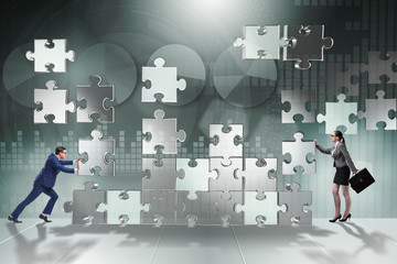 Business concept of teamwork with puzzle pieces