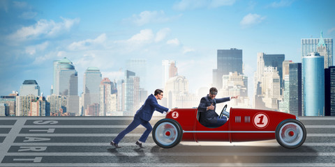 Businessman car pushing in teamwork concept