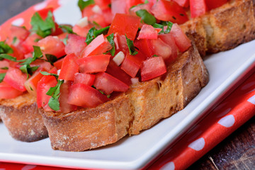 Bruschetta with tomatoes in a plate