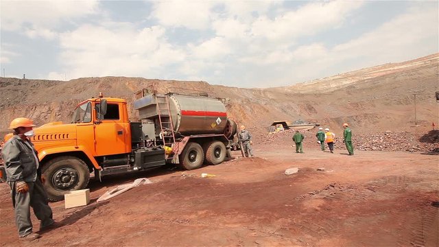 A special machine for mining in the quarry, Preparation of an explosion in the quarry, workers are preparing charges, mining of iron ore in the quarry, iron mine, Iron Ore Mining.