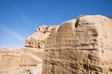 Ancient carved sandstone Djinn Blocks at the entrance of Petra, Jordan, the ancient Nabatean city...