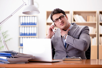 Businessman feeling pain in the office