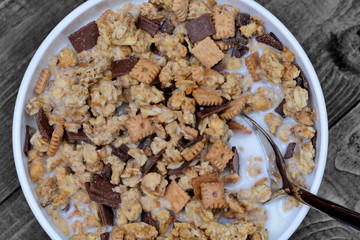 Muesli with milk in a ceramic bowl