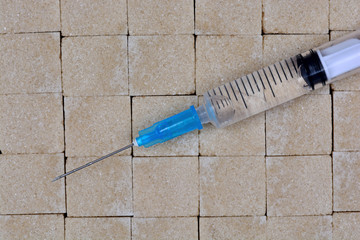 Brown sugar cubes with syringe
