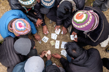 Sherpas are enjoying moments of card game in late afternoon in Himalaya, Nepal