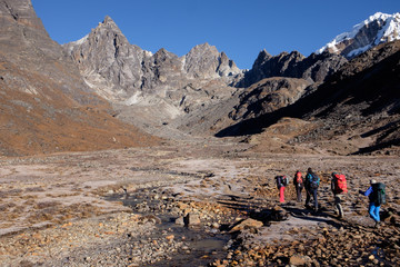 Hikers are heading towards Cho La Pass (5420 meters above sea level) in Himalaya, Nepal