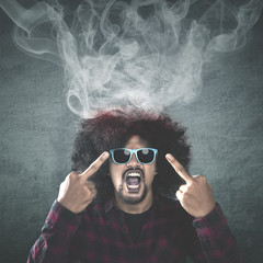 Angry Afro man showing middle fingers