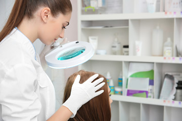 Woman visiting dermatologist at clinic
