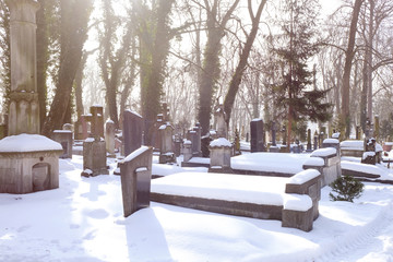 Cemetery with tombstones in winter