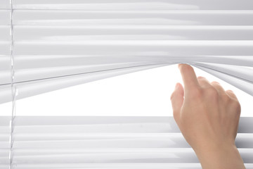 Human hand opening blinds