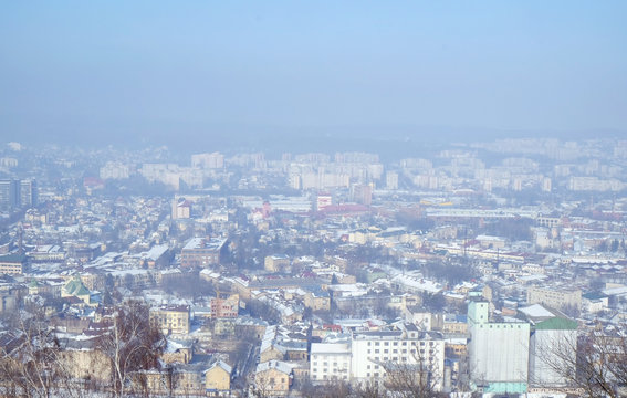 View of city from hill in winter